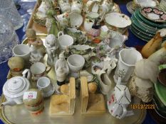 TRAY TO INCLUDE A STAFFORDSHIRE FIGURE OF A YOUNG CHILD IN A MOSES BASKET, SHOE ORNAMENTS WITH PUTTI