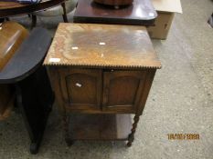 MID-20TH CENTURY OAK FRAMED SIDE CUPBOARD WITH TWO CUPBOARD DOORS OVER OPEN SHELF WITH BARLEY