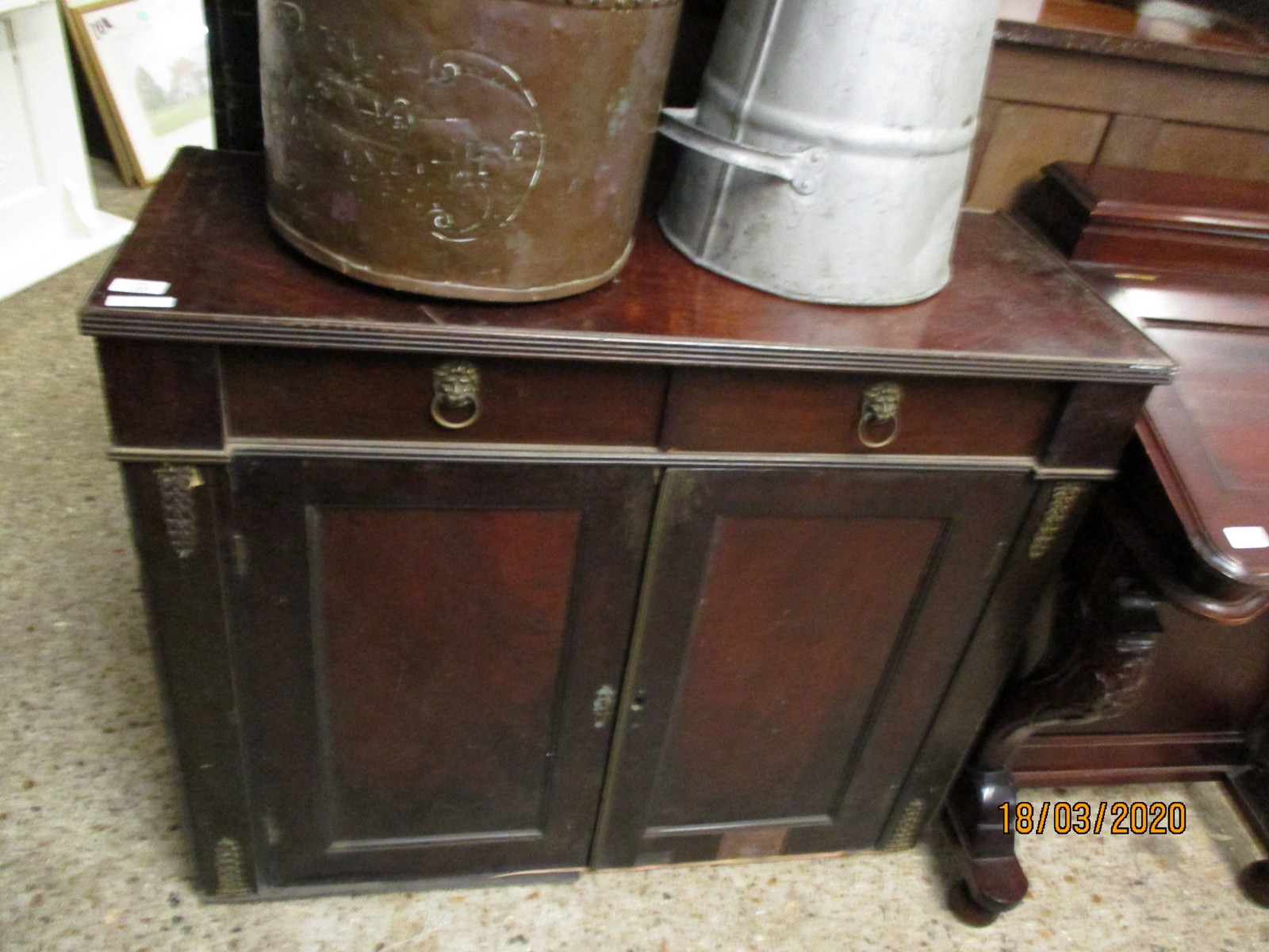 MAHOGANY SIDE CUPBOARD WITH TWO DRAWERS WITH LION HEAD HANDLES OVER TWO PANELLED CUPBOARD DOORS WITH