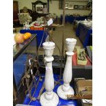 TWO WHITE PAINTED CANDLE STICKS, TWO TWISTED METAL CANDLE STICKS AND A FURTHER WALL HANGING (5)