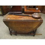 OAK FRAMED CIRCULAR DROP LEAF GATE LEG TABLE WITH CARVED TOP