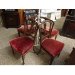 EDWARDIAN WALNUT CARVED SPLAT BACK DINING CHAIRS WITH RED UPHOLSTERED SEATS ON REEDED AND TURNED