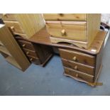 STAINED PINE FRAMED TWIN PEDESTAL DRESSING TABLE, EACH PEDESTAL FITTED WITH THREE DRAWERS WITH