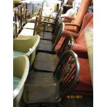SET OF FIVE HARD SEATED STICK BACK WHEEL BACK CHAIRS COMPRISING FOUR DINING CHAIRS AND A CARVER