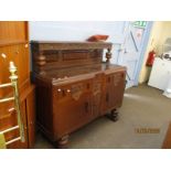 MID-20TH CENTURY OAK FRAMED SIDEBOARD WITH CARVED AND PANELLED TOP, THE BASE FITTED WITH TWO DRAWERS