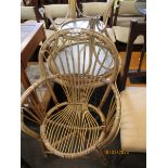 BAMBOO FRAMED ARMCHAIR AND TWO CIRCULAR BAMBOO FRAMED GLASS TOPPED TABLES (3)
