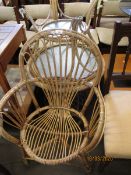 BAMBOO FRAMED ARMCHAIR AND TWO CIRCULAR BAMBOO FRAMED GLASS TOPPED TABLES (3)