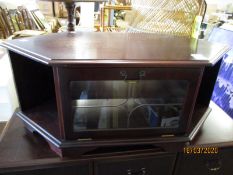 TEAK FRAMED TV CABINET OF DIAMOND FORM WITH GLASS DROP FRONTED DRAWER