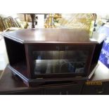 TEAK FRAMED TV CABINET OF DIAMOND FORM WITH GLASS DROP FRONTED DRAWER