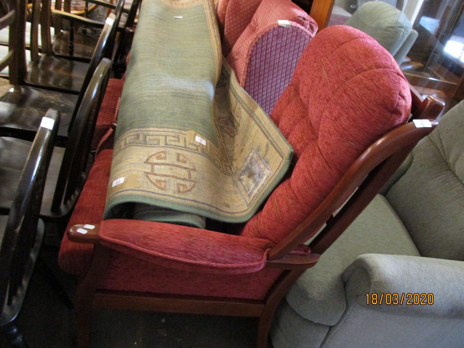 TEAK FRAMED RED UPHOLSTERED AND BUTTON BACK ARMCHAIR