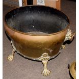 Brass two-handled oval planter applied with lion mask ring handles and raised on paw feet, 18cm long