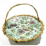 Late 19th century Canton plate with gilded metal mounts and handle, 27cm diam