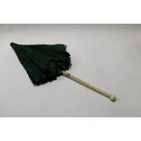 Vintage green fabric parasol with ivory shaft (cracked), circa late 19th century