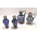 Group of four German salt glaze pottery jugs all with typical designs in blue and manganese (4)