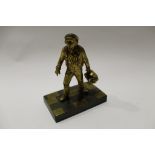 Small gilt bronze figure of a workman carrying a toolbox in his left hand, 11cm high