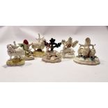 Group of Staffordshire wares including two sheep on yellow coloured bases, further group of sheep,
