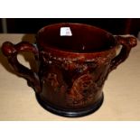 19th century Staffordshire treacle ground frog mug decorated in relief in typical style, the