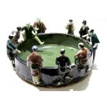 Unusual Japanese pottery bowl, the rim surrounded by ten Japanese figures in various poses,