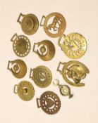 Box of various horse brasses