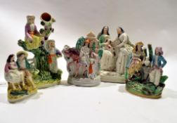 Group of Staffordshire figures including two ladies, grape pickers in Middle Eastern dress and