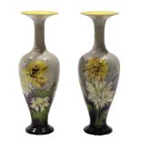 Pair of late 19th century Doulton Lambeth faience vases decorated with flowers on a grey ground, the