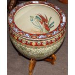 Chinese porcelain fish bowl with a scrolling design in green enamel below a polychrome rim mounted