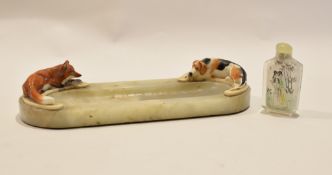 Vintage glass or alabaster ashtray, applied at either end with motifs of foxhound and fox, (losses