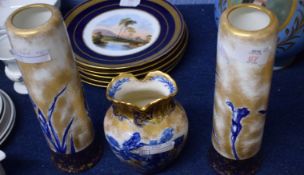 Pair of Doulton vases, the gilt ground decorated in blue with irises and further vase with similar