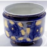 Late 19th century jardiniere, the white ground decorated with blue flowers and gilt surround, 24cm