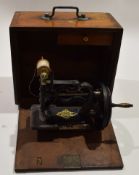 Late 19th century small cast metal framed hand sewing machine dated July 1891 in a drop front