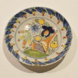 18th century Dutch Delft dish with polychrome decoration of flowers, 23cm diam