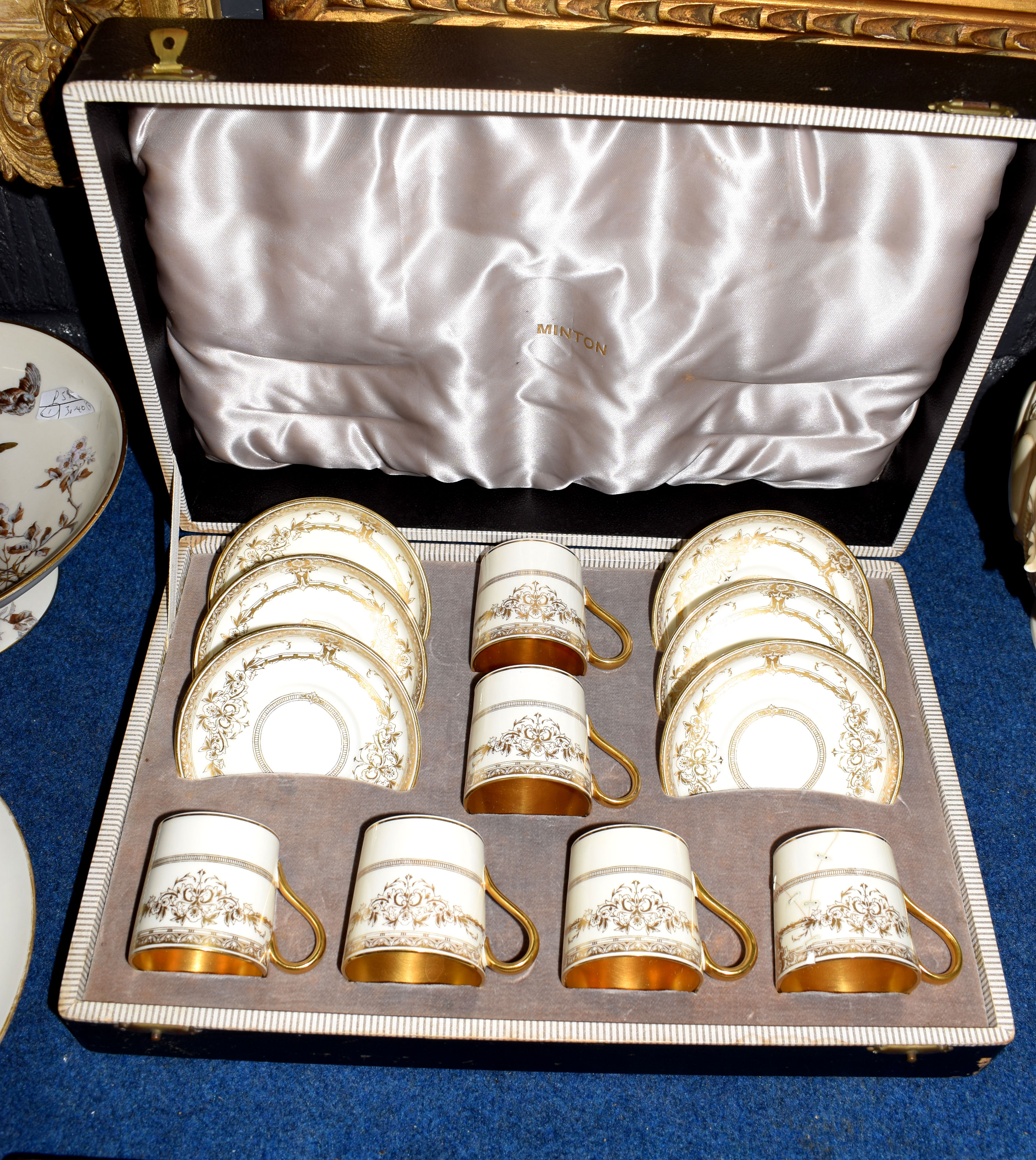 Minton Porcelain boxed coffee set with a gilt design, comprising six coffee cans and saucers,