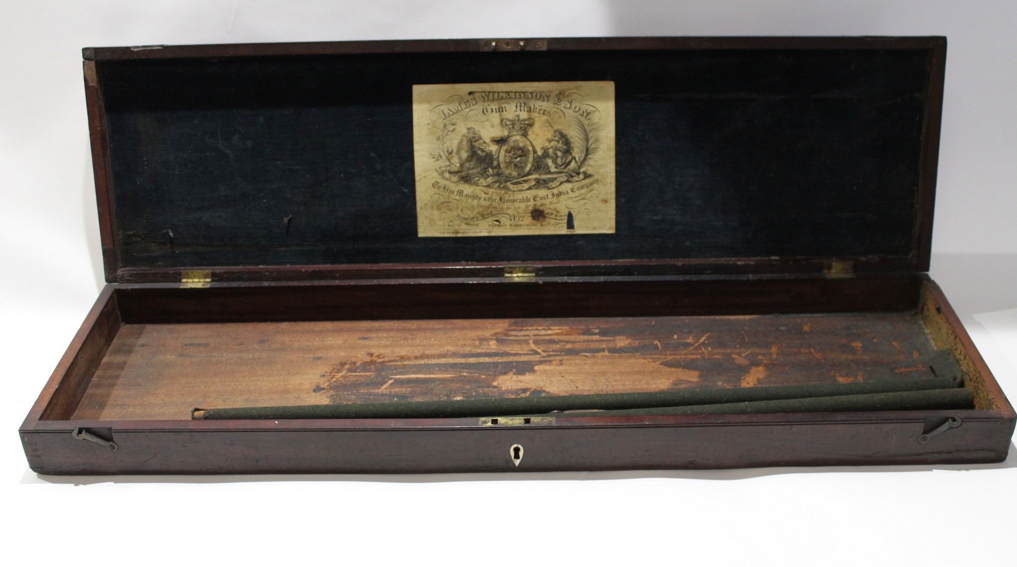 19th century mahogany gun case, plush lined lid applied with label for James Wilksinson, Gunmakers