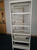 Strong metal shelving (white)- three units each approx 7 feet tall- with five shelves- and some