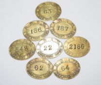 Collection of eight oval brass LNER ‘Norwich Loco’ railway Paychecks, various numbers.
