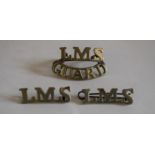 Three LMS nickel railway Badges : 1 x ‘LMS GUARD’ with two blade fittings, one broken, and