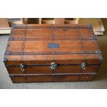 Sturdy wooden trunk 82 x 48 x 38cm, nameplate ‘S.P. Elliott’ on top. No key.