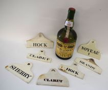 Collection of seven Ceramic Bin Tags to include the rare Noyeau No.1, together with a bottle of