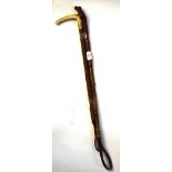 Two riding crops, one with carved wooden handle, the other with bone handle (2), largest 60cm long