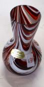 Red Art glass vase decorated with white swirls with Unikat sticker