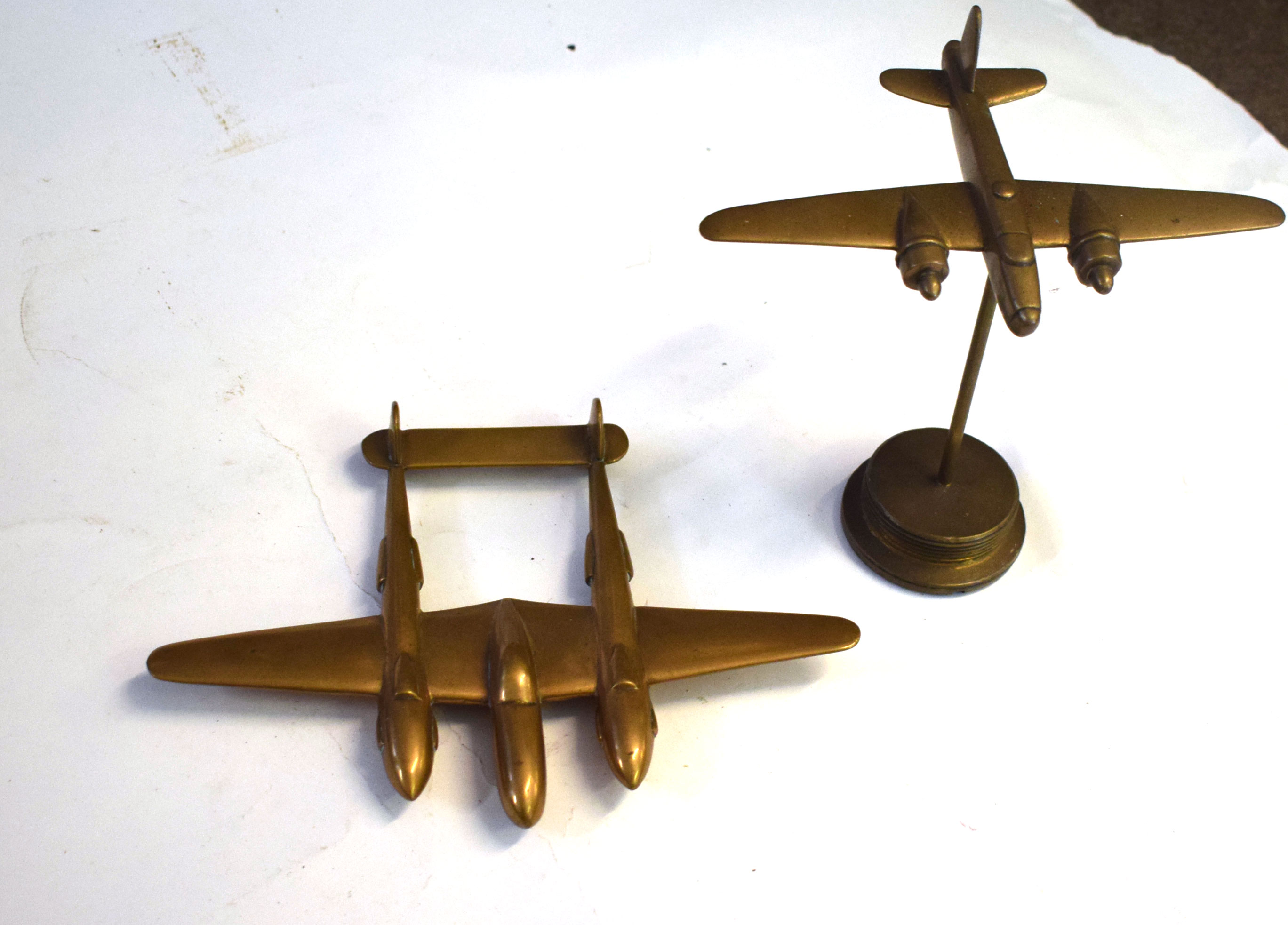 Two brass models of aircraft, one of a Liberator, the other of a Lockheed Lightning (2)