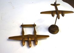 Two brass models of aircraft, one of a Liberator, the other of a Lockheed Lightning (2)