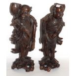 Pair of carved wooden Chinese figures on scroll bases (2)