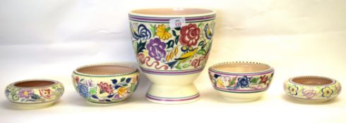 Group of Poole pottery wares with floral designs including Jardiniere and 4 bowls, Jardiniere 23cm