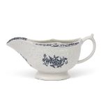Large 18th century Lowestoft porcelain sauce boat, the body with a moulded design with flowers