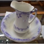 Late 19th century jug and wash basin decorated in tones of purple, jug 25cm high