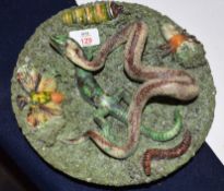 Portuguese or Pallasey style dish, the interior decorated in relief with a snake, insects, lizard