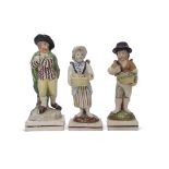 Group of three early 19th century pearlware figures, one of a skater on a rectangular base, two