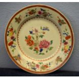 18th century Chinese porcelain plate decorated in famille rose style with a vase and flowers, the