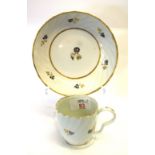 English porcelain wrythen shaped cup and saucer, cup with ear shaped handle and floral designs in